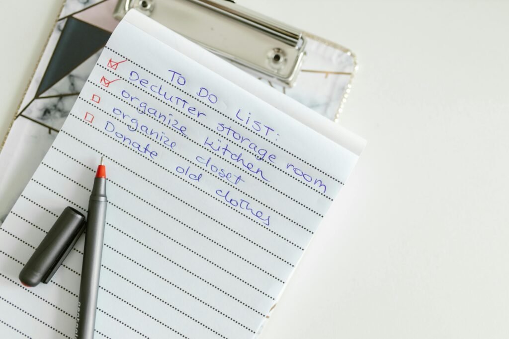 pexels-photo-8581014-8581014 A neatly written to-do list on lined paper with a pen, perfect for organizing tasks.