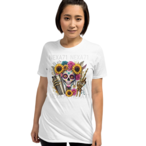 A white tshirt featuring a vibrant floral sugar skull design adorned with sunflowers and roses. The skeleton holds a gold Stanley cup with a straw in one hand and flashes a peace sign in the other. The design blends boho, spooky, and trendy aesthetics, making it a unique statement piece.